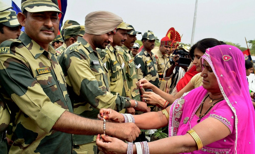 For the Border Security Force (BSF) jawans, posted away from their homes, Raksha Bandhan came as a surprise as several women thronged various security installations to tie rakhis on their wrists. PTI For the Border Security Force (BSF) jawans, posted away from their homes, Raksha Bandhan came as a surprise as several women thronged various security installations to tie rakhis on their wrists. PTI