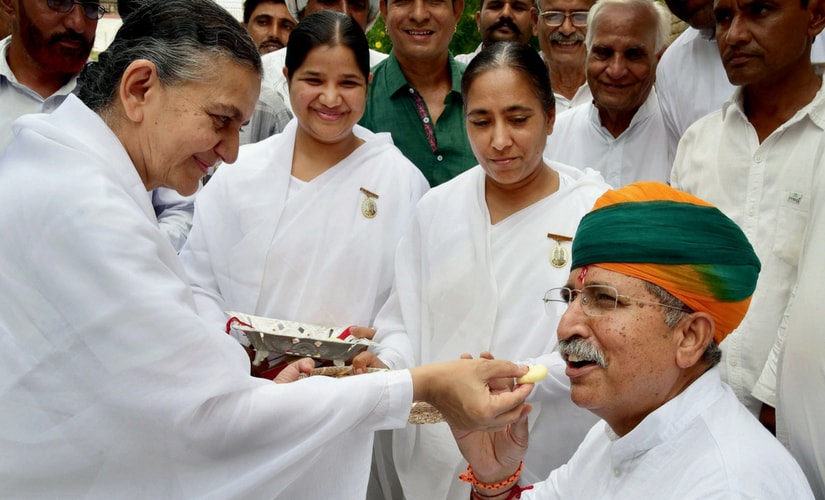 Brahma Kumaris tie rakhi and offer sweets to Union Minister of State for Finance Arjun Ram Meghwal on Raksha Bandhan, in Bikaner on Monday. President Ram Nath Kovind and Vice-President Hamid Ansari on Sunday had greeted the people on Raksha Bandhan. PTI Brahma Kumaris tie rakhi and offer sweets to Union Minister of State for Finance Arjun Ram Meghwal on Raksha Bandhan, in Bikaner on Monday. President Ram Nath Kovind and Vice-President Hamid Ansari on Sunday had greeted the people on Raksha Bandhan. PTI