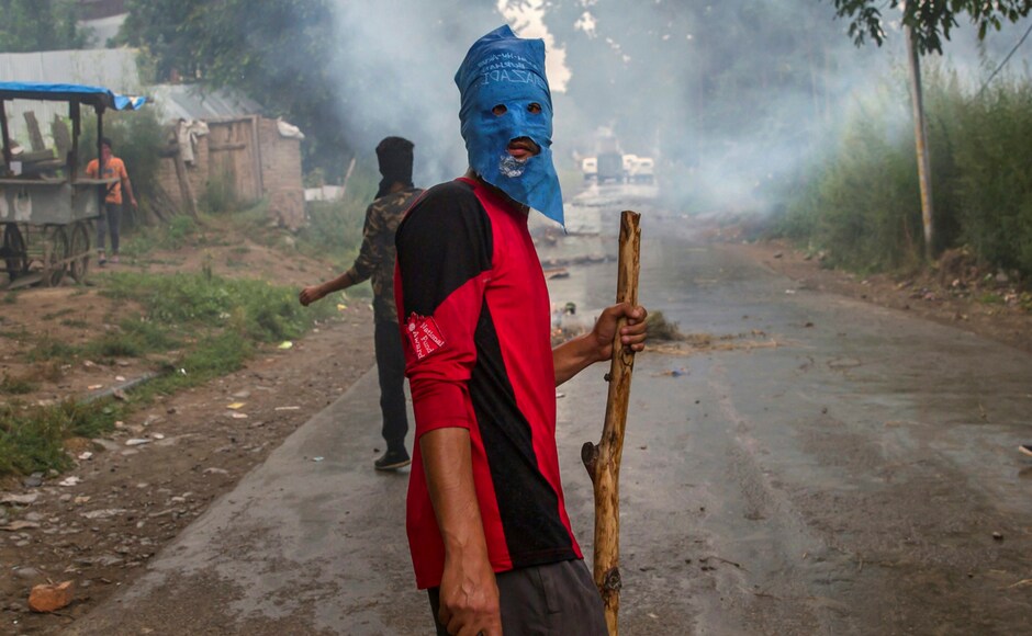 A masked villager during a protest following the funeral procession of Akeel Ahmed Bhat, a teenage boy in Haal village, about 47 kilometres (29 miles) south of Srinagar, Indian controlled Kashmir on Wednesday. A fresh strike called by anti-India separatists to protest the killings of two top rebels and a civilian shut down Kashmir on Wednesday while a teenage boy died a day after he was wounded by government forces. PTI A masked villager during a protest following the funeral procession of Akeel Ahmed Bhat, a teenage boy in Haal village, about 47 kilometres (29 miles) south of Srinagar, Indian controlled Kashmir on Wednesday. A fresh strike called by anti-India separatists to protest the killings of two top rebels and a civilian shut down Kashmir on Wednesday while a teenage boy died a day after he was wounded by government forces. PTI