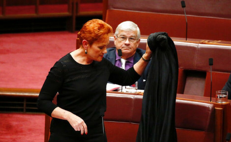 Senator Pauline Hanson removes the burqa in the Senate chamber at Parliament House in Canberra, Australia on Thursday. AP Senator Pauline Hanson removes the burqa in the Senate chamber at Parliament House in Canberra, Australia on Thursday. AP