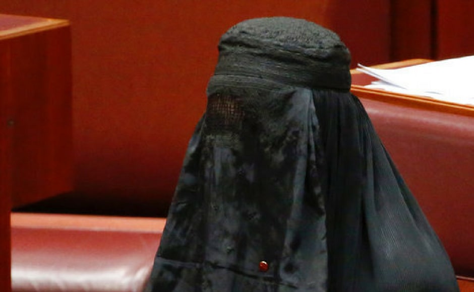 Senator Pauline Hanson rises to speak while wearing a burqa during question time in the Senate chamber at Parliament House in Canberra, Australia on Thursday. AP Senator Pauline Hanson rises to speak while wearing a burqa during question time in the Senate chamber at Parliament House in Canberra, Australia on Thursday. AP