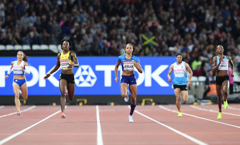 US athlete Allyson Felix (C) competes in the semi-finals of the women's 400m athletics event. India's Nirmala Sheron runs in the lane next to her. AFP
