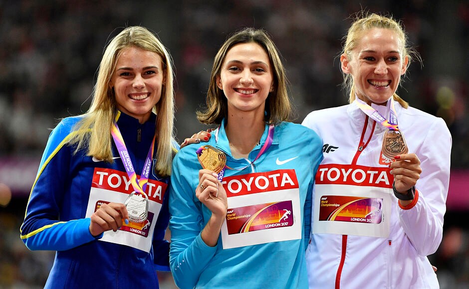 Maria Lasitskene became the first Russian to win a gold medal at the World Championships after successfully defending her high jump gold. Ukraine's Yuliia Levchenko(L) and Poland's Kamila Licwinko(R) won the silver and bronze medals. AP Maria Lasitskene became the first Russian to win a gold medal at the World Championships after successfully defending her high jump gold. Ukraine's Yuliia Levchenko(L) and Poland's Kamila Licwinko(R) won the silver and bronze medals. AP