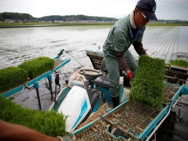 A farmer using rice planting machine Ryugasaki, Japan. Reuters