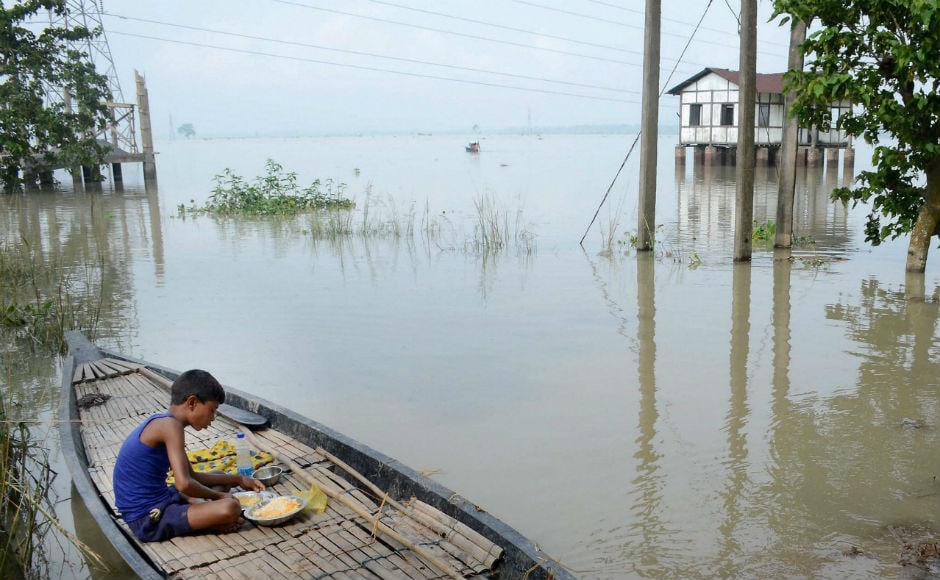 Hundreds of people were marooned in several inundated regions of Bihar and Assam even as heavy rains in other parts of the country flooded streets, choked traffic and hit normal life. PTI Hundreds of people were marooned in several inundated regions of Bihar and Assam even as heavy rains in other parts of the country flooded streets, choked traffic and hit normal life. PTI