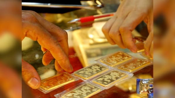Gold crosses Rs 33,000-mark per 10 gram on weak rupee, firm overseas trend; silver rises Rs 410 as local demand up
