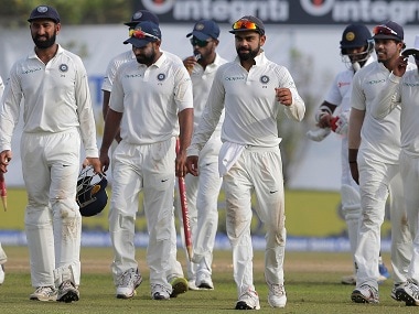 Virat Kohli leaves the ground with his teammates after their win in the first Test. AP