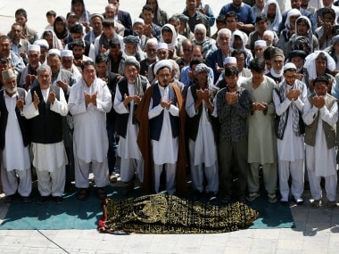 File image of people performing prayers for one of the victims of Kabul mosque attack. Reuters