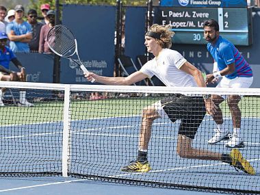 Alexander Zverev and Leander Paes in action in the opening round of the Cincinnati Masters. AFP