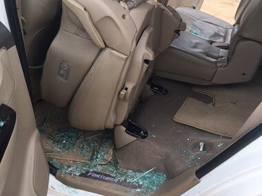 Smashed windows of Rahul Gandhi's car. Twitter/@@rssurjewala