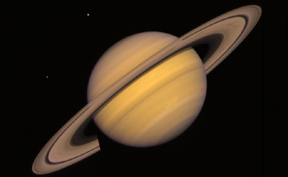 Saturn with some of its moons. Image: NASA. Saturn with some of its moons. Image: NASA.