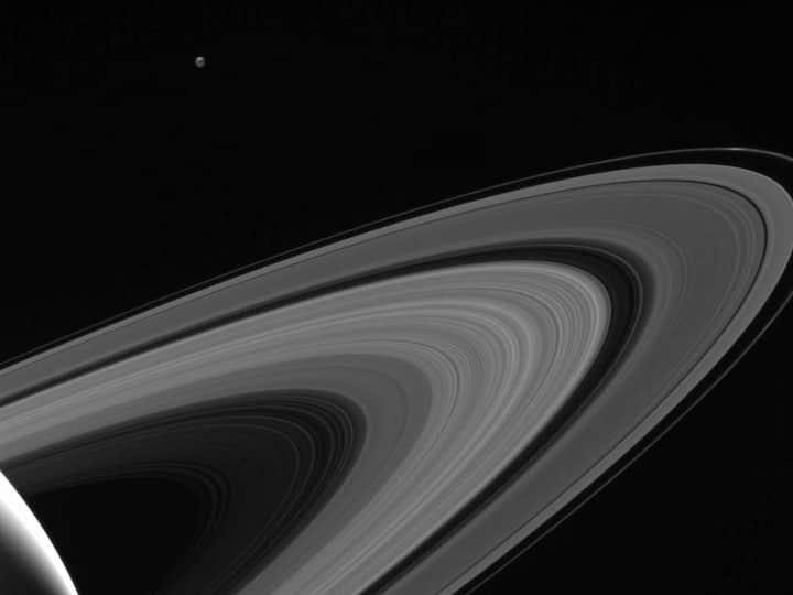 NASA's Cassini spacecraft captures the Saturnian moon Tethys lit up by light reflected from the planet