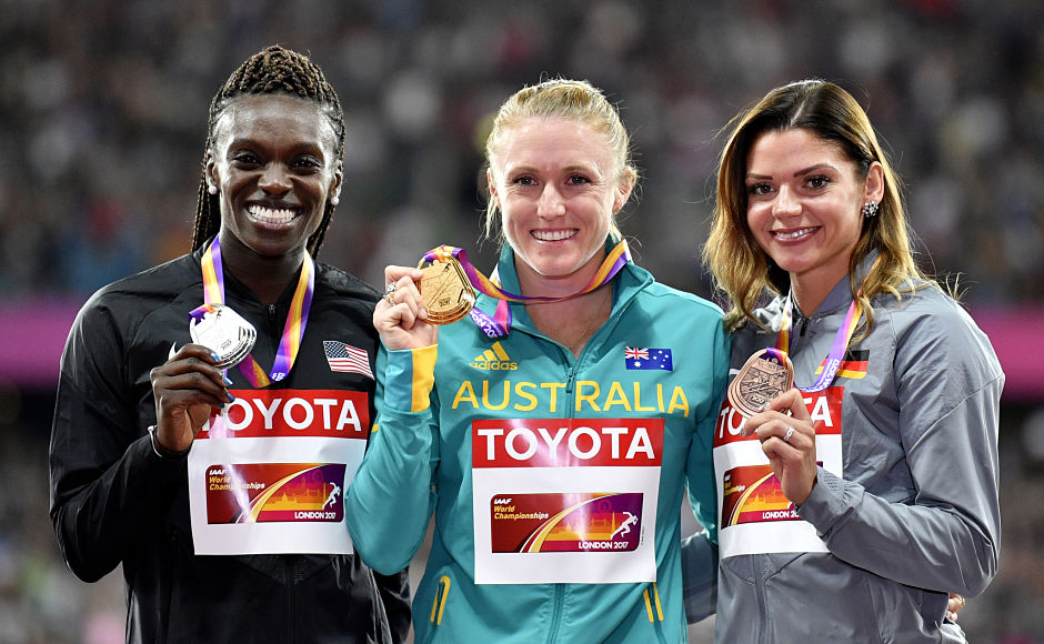 World champion in 2011 and Olympic gold medallist in 2012, Australia's Sally Pearson, centre, overcame two years of injury agony to mark her comeback with a gold in the 100m hurdles at the World Championships with a speed of 12.59 seconds as United States' Dawn Harper Nelson(L) won the silver and Germany added to its medal tally with Pamela Dutkiewicz(R) winning the bronze. AP World champion in 2011 and Olympic gold medallist in 2012, Australia's Sally Pearson, centre, overcame two years of injury agony to mark her comeback with a gold in the 100m hurdles at the World Championships with a speed of 12.59 seconds as United States' Dawn Harper Nelson(L) won the silver and Germany added to its medal tally with Pamela Dutkiewicz(R) winning the bronze. AP