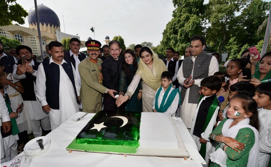 In New Delhi, acting Pakistan high commissioner Syed Haider Shah and his wife Palwasha Haider marked the occasion by cutting a cake at Pakistan High Commission in New Delhi to mark the occasion. PTI In New Delhi, acting Pakistan high commissioner Syed Haider Shah and his wife Palwasha Haider marked the occasion by cutting a cake at Pakistan High Commission in New Delhi to mark the occasion. PTI