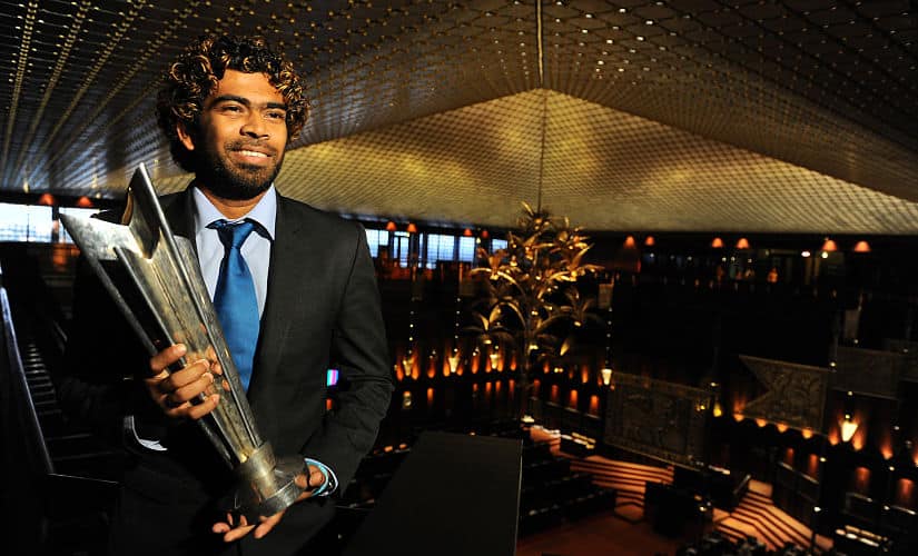 Sri Lanka’s T20 cricket captain Lasith Malinga poses for a photograph with the World Cup trophy at the Sri Lankan Parliament in Colombo on April 9, 2014. Sri Lankan legislators invited the national team to the parliament building for a ceremony celebrating their victory over India in the ICC T20 cricket tournament final in Dhaka. AFP PHOTO/Ishara S.KODIKARA / AFP PHOTO / Ishara S.KODIKARA