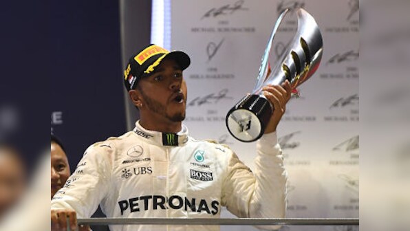 Singapore Grand Prix: Lewis Hamilton emerges winner in chaotic race, rival Sebastian Vettel crashes out