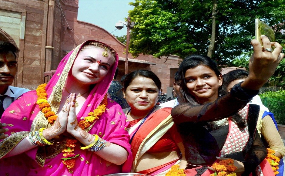 The reminder comes following a particularly turbulent year for international tourism. Across Europe, this summer, a wave of anti-tourism marches were staged to protest unchecked visitor numbers and disrespectful tourists. In the photo clicked in Agra, a foreign tourist is being welcomed at the eastern gate of Taj Mahal. PTI The reminder comes following a particularly turbulent year for international tourism. Across Europe, this summer, a wave of anti-tourism marches were staged to protest unchecked visitor numbers and disrespectful tourists. In the photo clicked in Agra, a foreign tourist is being welcomed at the eastern gate of Taj Mahal. PTI