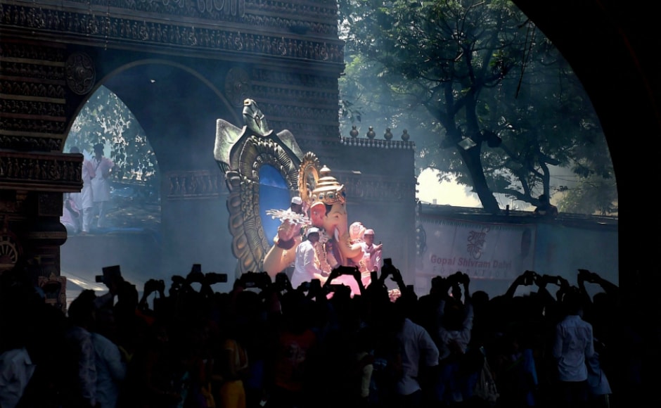 The idols were brought onto the roads accompanied by the beats of <em>dhols</em> (drums) and cymbals, thousands dancing and chanting The idols were brought onto the roads accompanied by the beats of <em>dhols</em> (drums) and cymbals, thousands dancing and chanting
