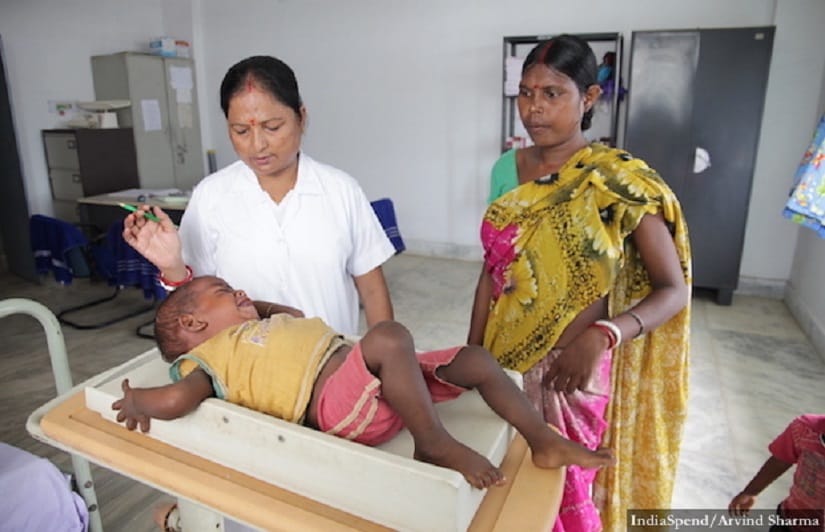 Rinku Mukherjee, a nurse with 10 years of experience, weighing a child at the malnutrition treatment centre in Ghatshila sub divisional hospital, East Singhbhum district, Jharkhand.