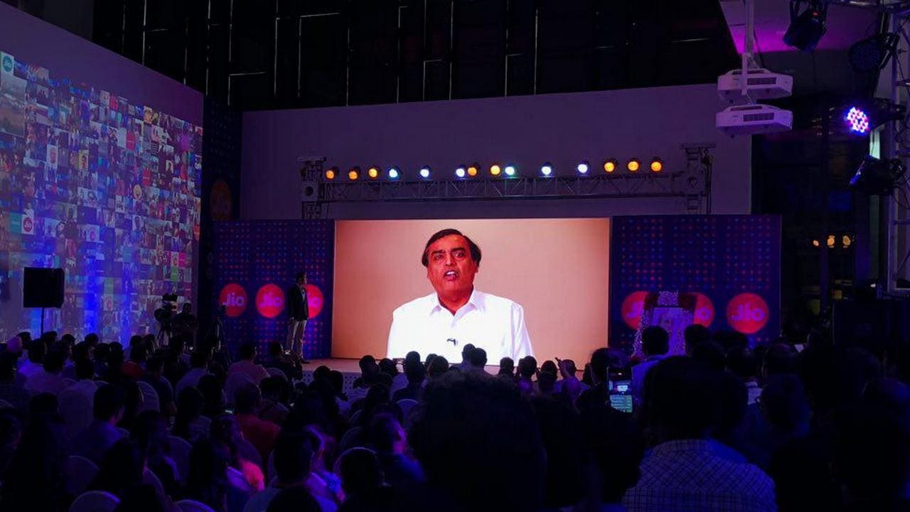 RIL Chairman Mukesh Ambani appears on a video stream at Jio's iPhone 8 launch.