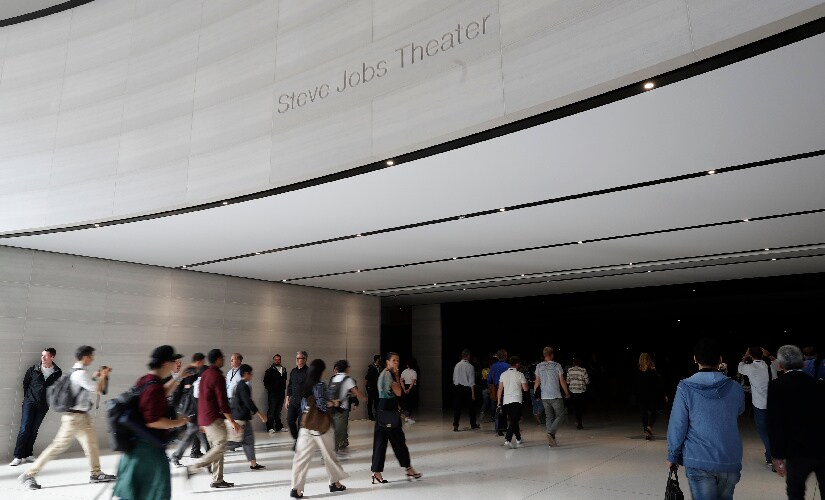 People enter the Steve Jobs Theater before the start of a product launch event at Apple's new campus in Cupertino, California, U.S. September 12, 2017. REUTERS/Stephen Lam - HP1ED9C1AYQA6