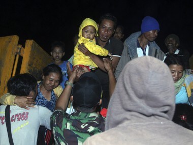 Thousands in Indonesia flee Bali island as authorities raise volcano alert status to highest level