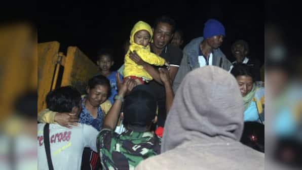 Thousands in Indonesia flee Bali island as authorities raise volcano alert status to highest level
