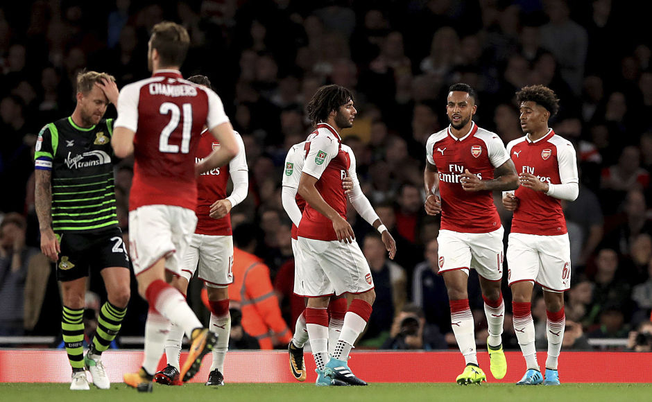 Theo Walcott was on target for Arsenal as the Gunners beat Doncaster Rovers to go through to the fourth round. AP Theo Walcott was on target for Arsenal as the Gunners beat Doncaster Rovers to go through to the fourth round. AP