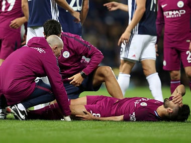 Manchester City's Ilkay Gundogan lays injured during the League Cup Third Round soccer match, West Bromwich Albion versus Manchester City at The Hawthorns, West Bromwich, England, Wednesday Sept. 20, 2017. (David Davies/PA via AP)