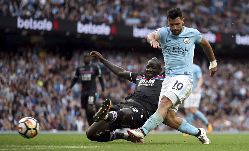 Manchester City's Sergio Aguero, right,shoots under pressure from Crystal Palace's Mamadou Sakho, during the English Premier League soccer match between Manchester City and Crystal Palace, at the Etihad Stadium, in Manchester, England, Saturday, Sept. 23, 2017. (Nick Potts/PA via AP)