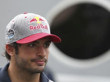 Toro Rosso’s Carlos Sainz Jr arrives at the Marina Bay City Circuit ahead of the Singapore Grand Prix on Friday. AP