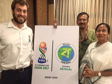 File image of West Bengal CM Mamta Baneerjee unveiling host city logo alongside Javi Ceppi. Image courtesy Twitter @IndianFootball