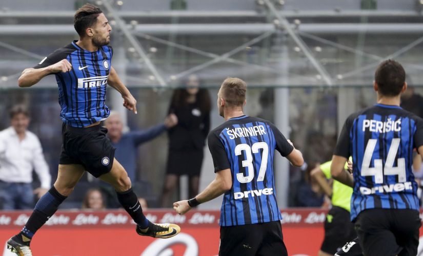 Inter Milan's Danilo D'Ambrosio, left, celebrates after he score during a Serie A soccer match between Inter Milan and Genoa, at Milan's San siro Stadium, northern Italy, Sunday, Sept. 24, 2017. (AP Photo/Luca Bruno)