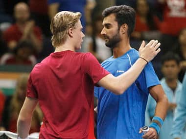 Canada's Denis Shapovalov, left, and India's Yuki Bhambri after their match in Davis Cup. AP