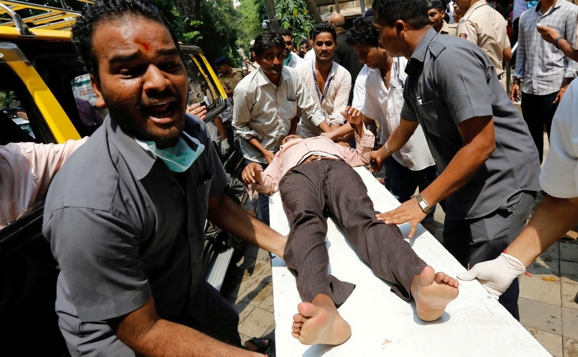 A stampede victim is carried on a stretcher at a hospital in Mumbai. Reuters