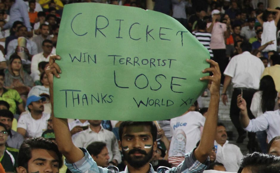 A fan at the Gaddafi Stadium holds a placard during the third T20I between Pakistan and World XI. AP A fan at the Gaddafi Stadium holds a placard during the third T20I between Pakistan and World XI. AP