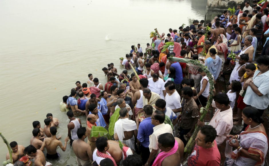 In Kolkata, thousands flocked to the banks of River Ganges to seek its blessing. AP In Kolkata, thousands flocked to the banks of River Ganges to seek its blessing. AP