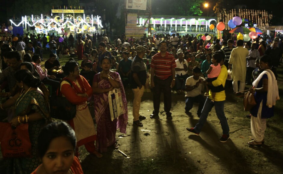 Thousands of people from all walks of life poured into the streets and queued in front of puja pandals to view the idols, imaginative decorations and illuminations showcasing themes. AP Thousands of people from all walks of life poured into the streets and queued in front of puja pandals to view the idols, imaginative decorations and illuminations showcasing themes. AP