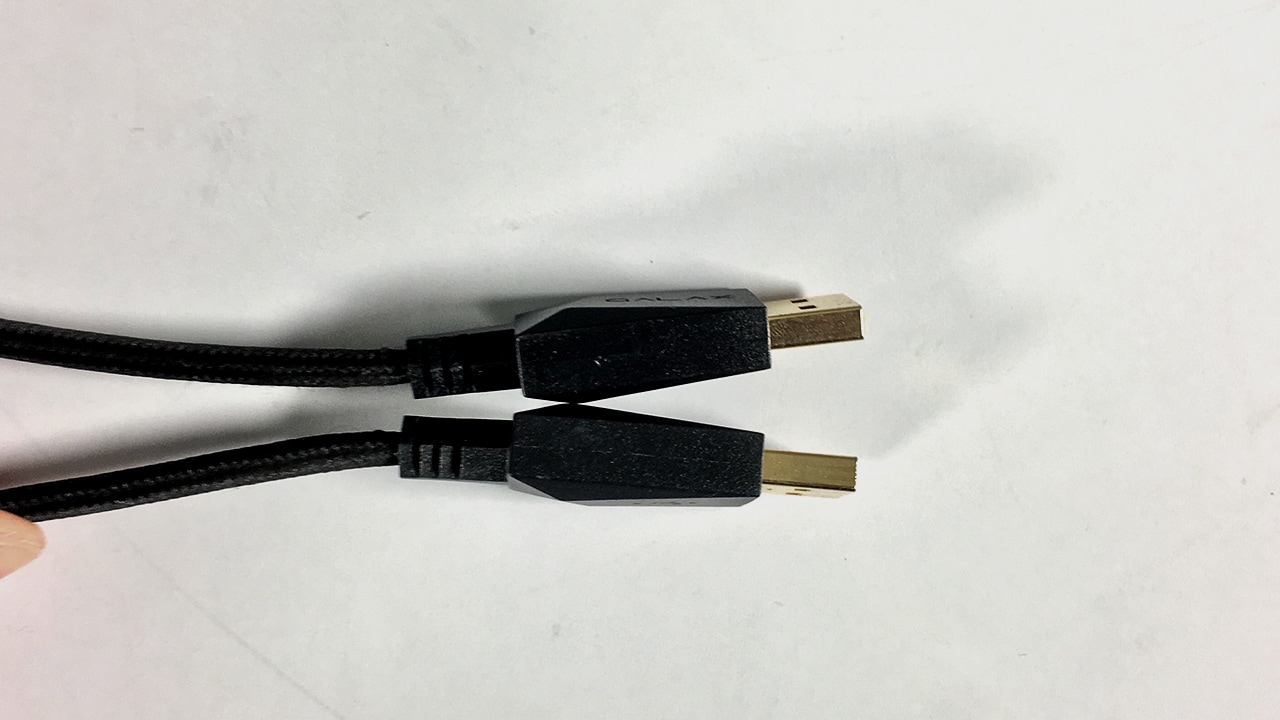 The USB housing is too thick to allow you to plug them in to ports placed one above the other.