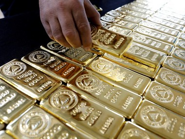 Gold prices off 14-month peak on firmer dollar as investors await US Federal Reserve meeting this week Gold prices off 14-month peak on firmer dollar as investors await US Federal Reserve meeting this week