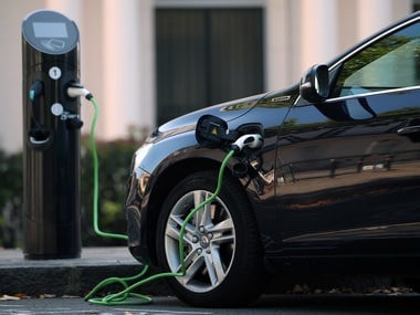 A hybrid electric car plugged in for charging. Image: Reuters