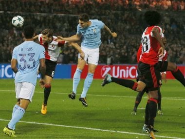 Manchester City's John Stones, center, heads the ball toward the goal during a Champions League Group F soccer match between Feyenoord and Manchester City at the Kuip stadium in Rotterdam, Netherlands, Wednesday, Sept. 13, 2017. (AP Photo/Peter Dejong)