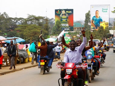 Supporters of opposition leader Raila Odinga celebrate after hearing the verdict, in Kibera, Nairobi. AP