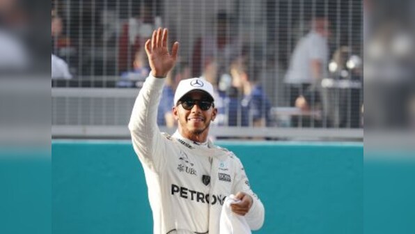 Malaysian Grand Prix: Lewis Hamilton capitalises on Sebastian Vettel's misery to claim 70th career pole