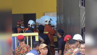 Malaysian police arrest seven students suspected of starting deadly school fire that killed 23 including children