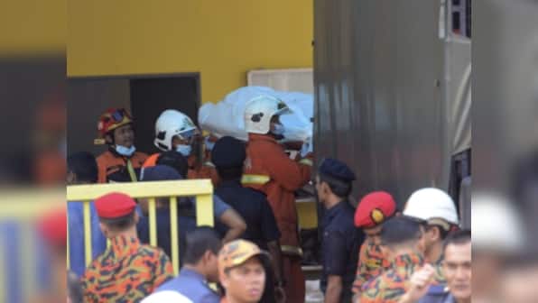 Malaysian police arrest seven students suspected of starting deadly school fire that killed 23 including children