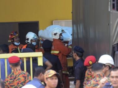 Malaysian police arrest seven students suspected of starting deadly school fire that killed 23 including children