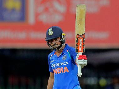 India’s Manish Pandey raises his bat to celebrate scoring a fifty. AP 