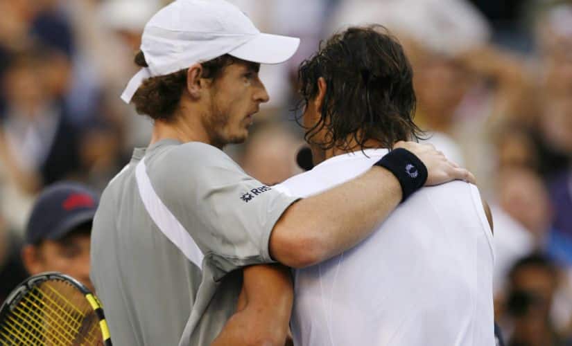 Rafael Nadal of Spain (R) embraces Andy Murray of Britain after their rain delayed semi-final match at the U.S. Open tennis tournament at Flushing Meadows in New York September 7, 2008. REUTERS/Kevin Lamarque (UNITED STATES) - GM1E4980IZB01