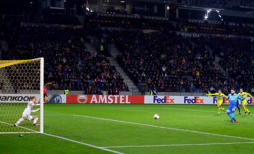 Olivier Giroud scores Arsenal’s fourth goal from the penalty spot during the Europa League group H match. AP
